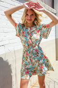 Get Whimsical Tropical Print Smocked Waist Neck Button Romper